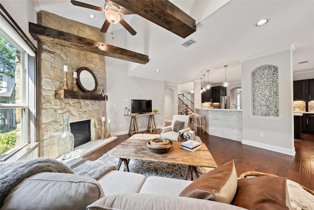108 Kildrummy Ln, Lakeway, TX 78738 - living area with ceiling fan, dark wood-style flooring, a fireplace, stairway, and beam ceiling