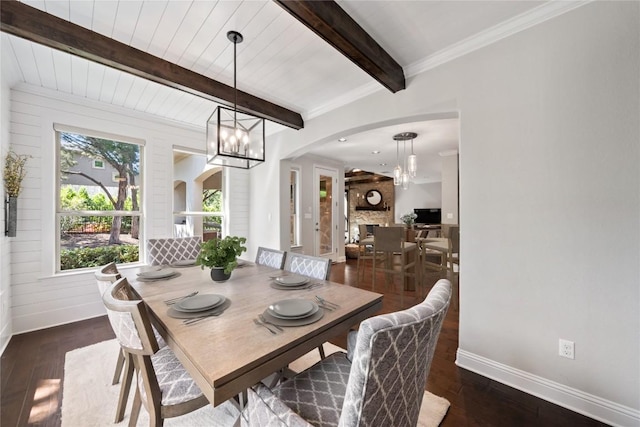 108 Kildrummy Ln, Lakeway, TX 78738 - dining area with arched walkways, wood finished floors, beam ceiling, and a chandelier