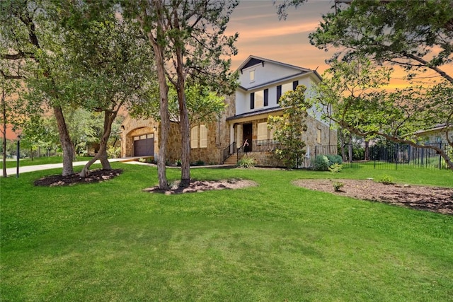 108 Kildrummy Ln, Lakeway, TX 78738 - view of front of property with a garage, stone siding, concrete driveway, and a porch