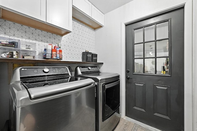 11803 Jess Dr, Austin, TX 78737 - laundry room featuring cabinet space, independent washer and dryer, and light wood-style floors