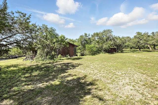 11803 Jess Dr, Austin, TX 78737 - view of grassy yard with an outbuilding