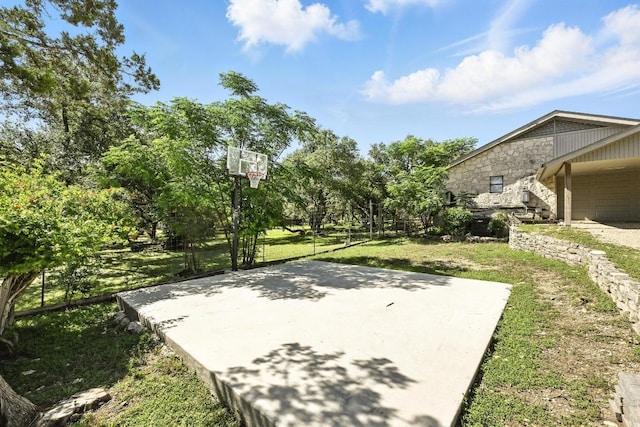 11803 Jess Dr, Austin, TX 78737 - view of basketball court featuring a lawn and basketball hoop