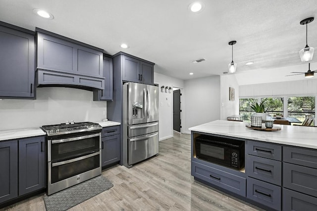 11803 Jess Dr, Austin, TX 78737 - kitchen featuring stainless steel appliances, custom exhaust hood, decorative light fixtures, light wood finished floors, and light stone counters