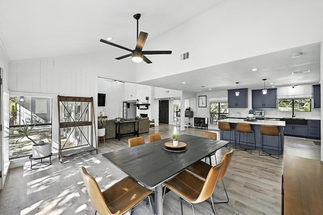 11803 Jess Dr, Austin, TX 78737 - dining space featuring high vaulted ceiling, a ceiling fan, light wood finished floors, and recessed lighting