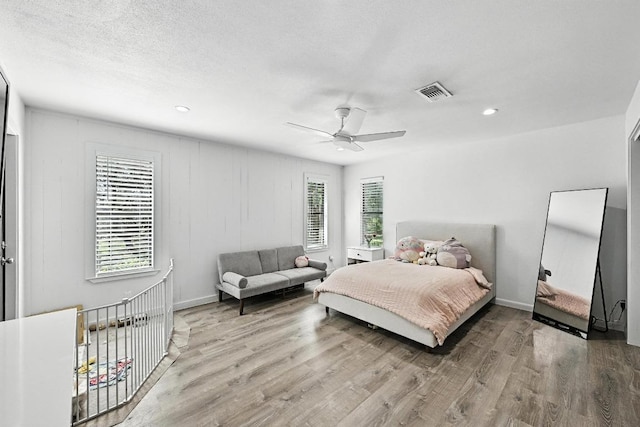 11803 Jess Dr, Austin, TX 78737 - bedroom with wood finished floors, ceiling fan, and recessed lighting