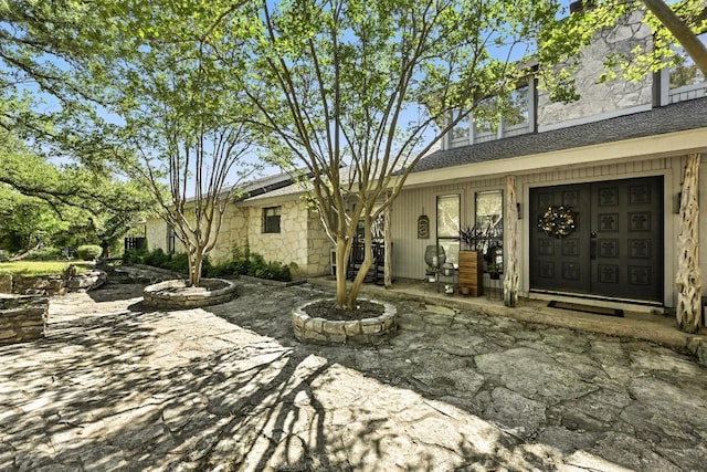 11803 Jess Dr, Austin, TX 78737 - entrance to property with stone siding and a patio area