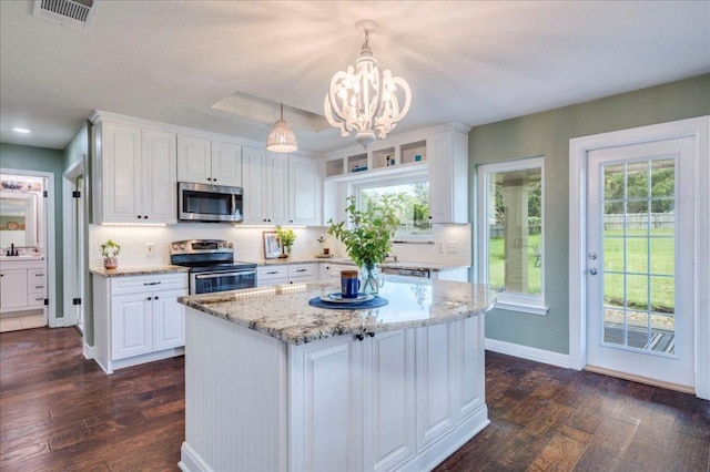 200 S Prairie Ln, Georgetown, TX 78633 - kitchen featuring appliances with stainless steel finishes, dark wood-style flooring, and white cabinetry
