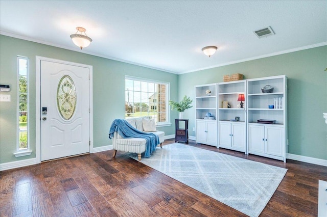200 S Prairie Ln, Georgetown, TX 78633 - entrance foyer with dark wood-style flooring and ornamental molding