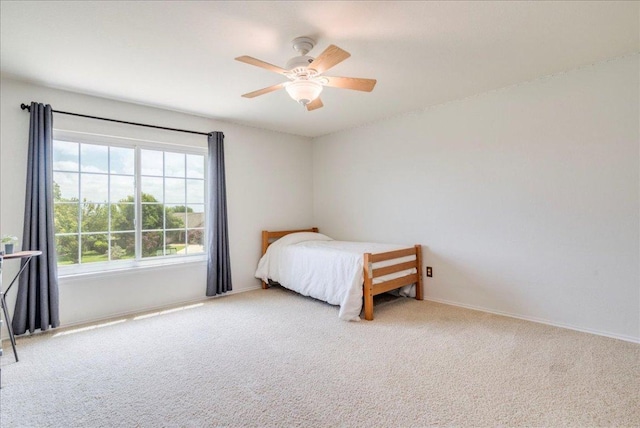 200 S Prairie Ln, Georgetown, TX 78633 - bedroom featuring carpet flooring and ceiling fan