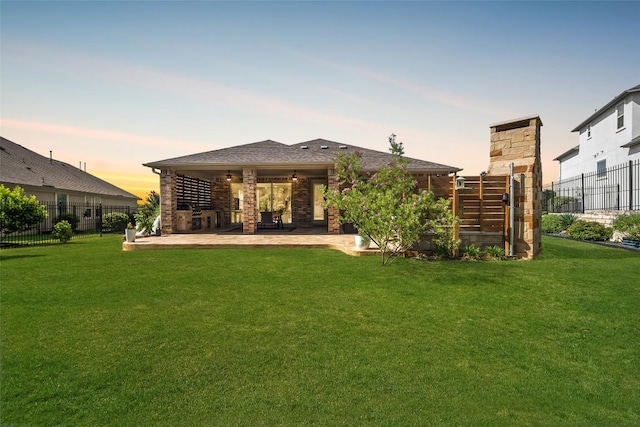 2541 Reunion Blvd, Austin, TX 78737 - back of property at dusk with a patio area