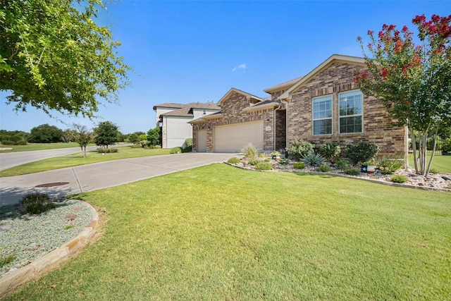 2541 Reunion Blvd, Austin, TX 78737 - view of front facade featuring a garage, a front yard, concrete driveway, and brick siding