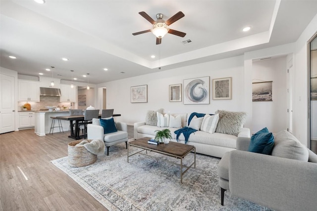 2541 Reunion Blvd, Austin, TX 78737 - living area featuring ceiling fan, light wood-type flooring, recessed lighting, and a raised ceiling