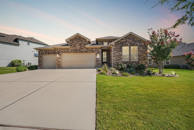 2541 Reunion Blvd, Austin, TX 78737 - view of front of house featuring an attached garage, concrete driveway, and a yard