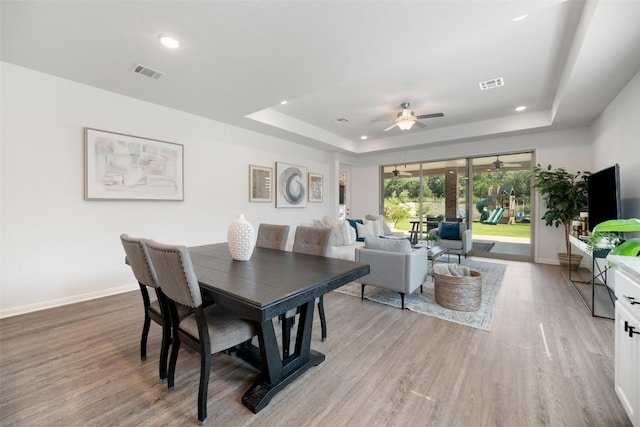 2541 Reunion Blvd, Austin, TX 78737 - dining room with a raised ceiling, ceiling fan, recessed lighting, and light wood finished floors