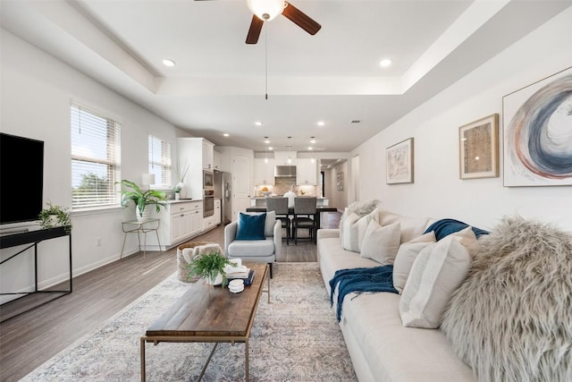 2541 Reunion Blvd, Austin, TX 78737 - living area with a raised ceiling, light wood-style floors, ceiling fan, and recessed lighting