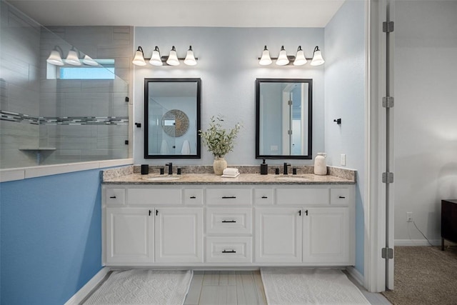 2541 Reunion Blvd, Austin, TX 78737 - bathroom featuring double vanity and tiled shower