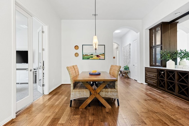 2977 Diego Dr, Round Rock, TX 78665 - dining area featuring arched walkways and light wood-type flooring