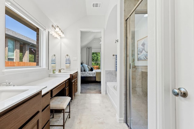 2977 Diego Dr, Round Rock, TX 78665 - ensuite bathroom with vaulted ceiling, double vanity, a shower stall, and a bath