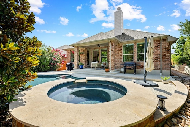 2977 Diego Dr, Round Rock, TX 78665 - view of swimming pool with a patio area, a ceiling fan, area for grilling, and a pool with connected hot tub