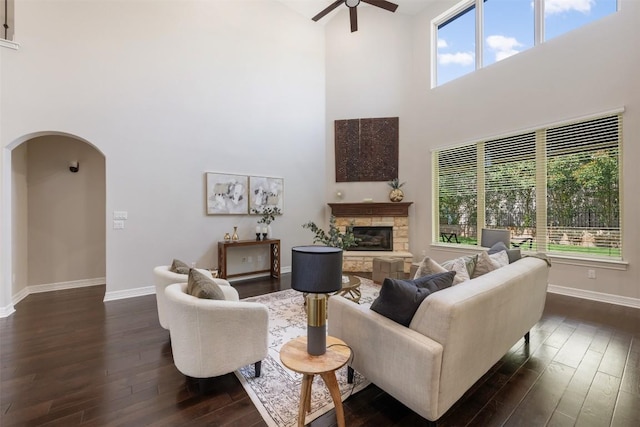 201 Montalcino Blvd, Austin, TX 78734 - living area featuring ceiling fan, dark wood-type flooring, arched walkways, a high ceiling, and plenty of natural light