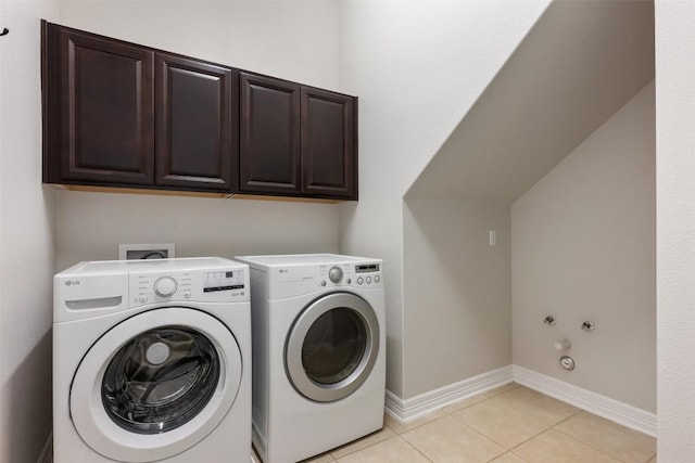 201 Montalcino Blvd, Austin, TX 78734 - laundry room featuring washer and dryer, cabinet space, and light tile patterned flooring