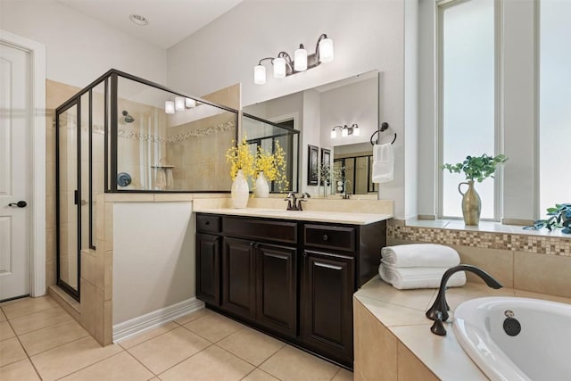 201 Montalcino Blvd, Austin, TX 78734 - bathroom featuring vanity, a bath, a stall shower, and tile patterned floors