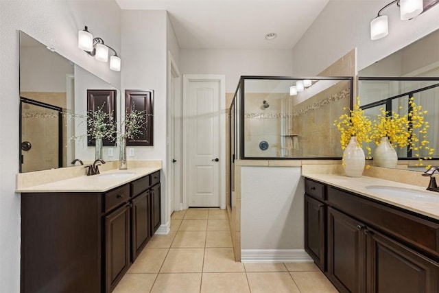 201 Montalcino Blvd, Austin, TX 78734 - bathroom with a stall shower, two vanities, and tile patterned floors