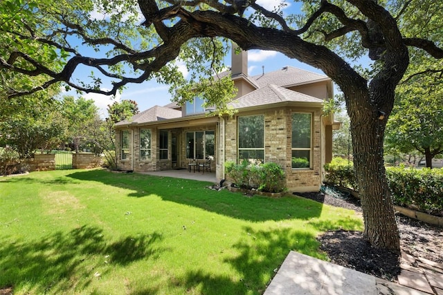201 Montalcino Blvd, Austin, TX 78734 - back of house featuring a patio and brick siding