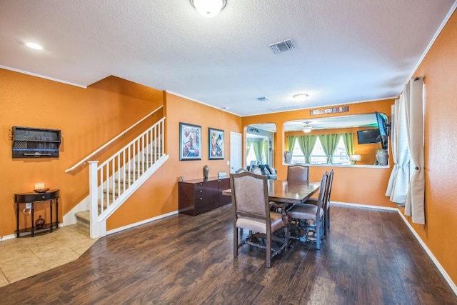 6401 Quinton Dr, Austin, TX 78747 - dining room featuring stairs, wood finished floors, ceiling fan, and a textured ceiling