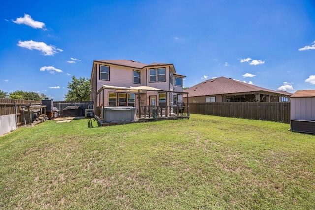 6401 Quinton Dr, Austin, TX 78747 - back of house featuring a hot tub and a fenced backyard