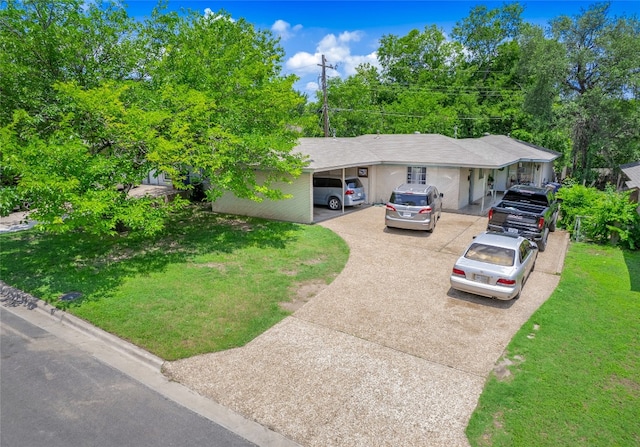 8508 Dryfield Dr, Austin, TX 78758 - view of front of house featuring driveway, a front yard, and an attached carport