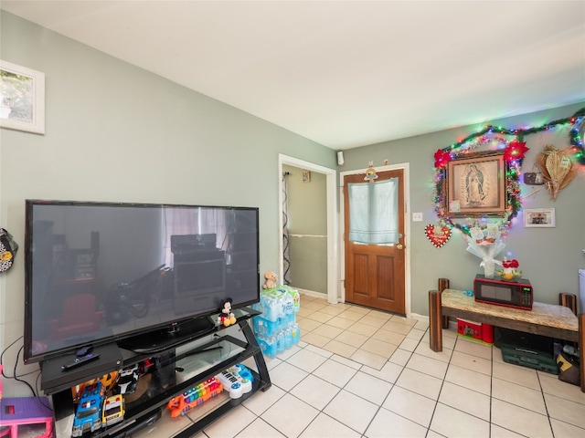 8508 Dryfield Dr, Austin, TX 78758 - living area featuring light tile patterned flooring and baseboards