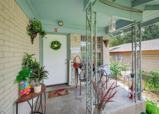 8508 Dryfield Dr, Austin, TX 78758 - view of exterior entry with a porch and brick siding