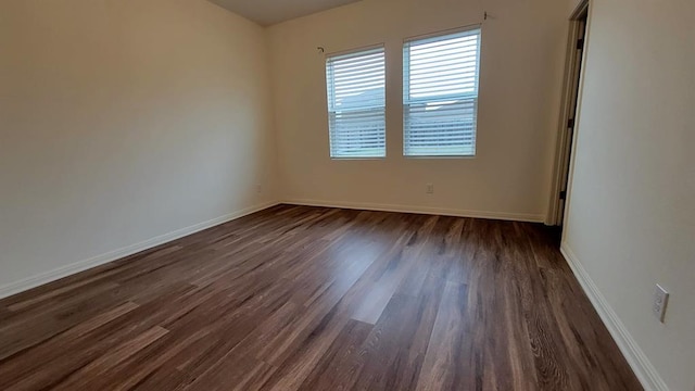 850 Bunton Reserve Blvd, Kyle, TX 78640 - spare room featuring dark wood-type flooring and baseboards