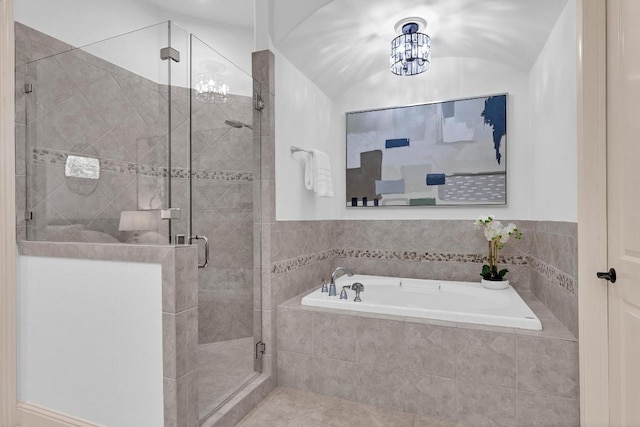 14417 Heron Bay Cv, Bee Cave, TX 78738 - bathroom with a bath, a stall shower, and tile patterned flooring