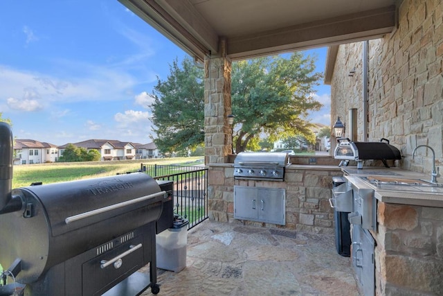 14417 Heron Bay Cv, Bee Cave, TX 78738 - view of patio with area for grilling and a residential view