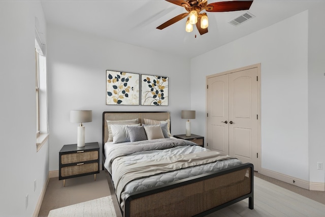 14417 Heron Bay Cv, Bee Cave, TX 78738 - bedroom featuring a closet, light colored carpet, and ceiling fan
