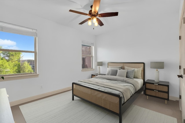 14417 Heron Bay Cv, Bee Cave, TX 78738 - bedroom with a ceiling fan and baseboards