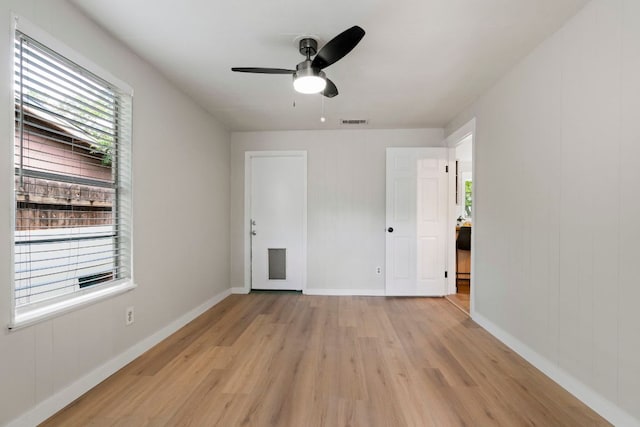 1040 Rosemont St, Austin, TX 78723 - unfurnished bedroom with light wood-style floors and ceiling fan