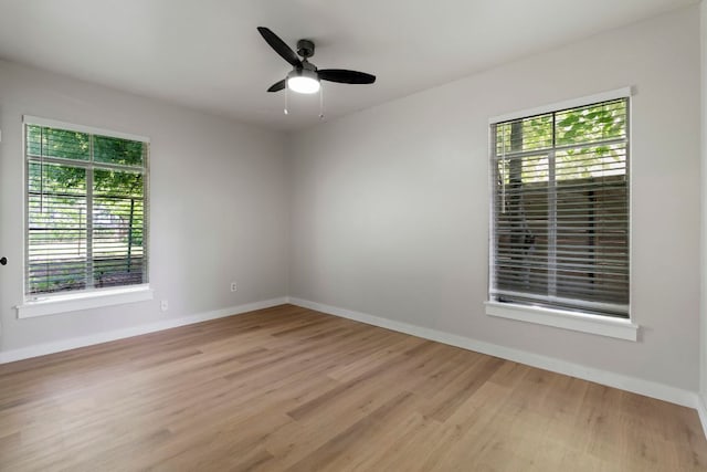1040 Rosemont St, Austin, TX 78723 - spare room with healthy amount of natural light, light wood-type flooring, and ceiling fan