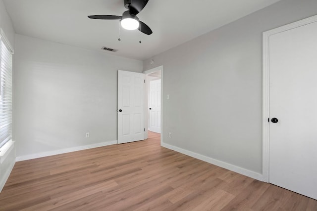 1040 Rosemont St, Austin, TX 78723 - unfurnished bedroom with light wood-style floors and ceiling fan