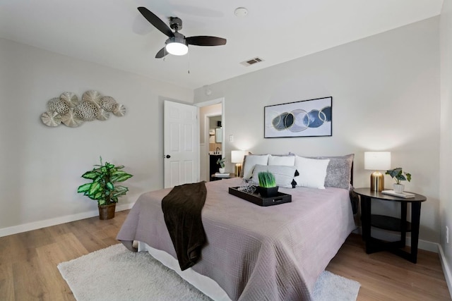 1040 Rosemont St, Austin, TX 78723 - bedroom with wood finished floors and ceiling fan