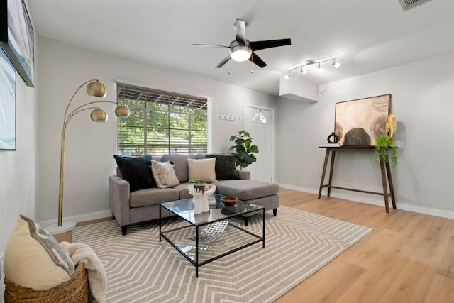 1040 Rosemont St, Austin, TX 78723 - living area featuring light wood-type flooring and ceiling fan