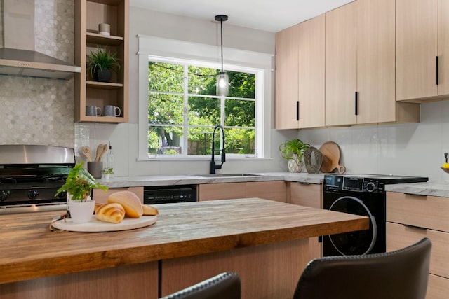 1040 Rosemont St, Austin, TX 78723 - kitchen with wall chimney exhaust hood, wood counters, gas stove, tasteful backsplash, and light brown cabinetry