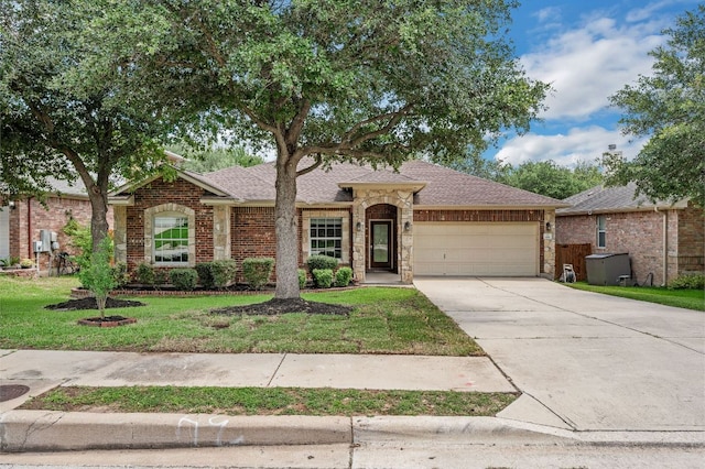 202 Muscovy Ln, Cedar Park, TX 78613 - ranch-style house with a garage, driveway, a front yard, and a shingled roof