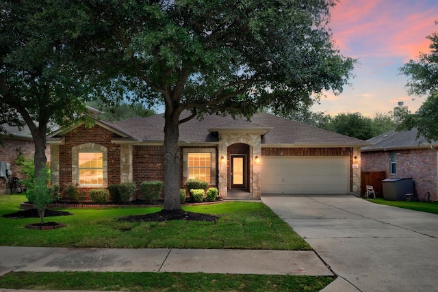 202 Muscovy Ln, Cedar Park, TX 78613 - ranch-style house with a garage, concrete driveway, a front yard, roof with shingles, and brick siding