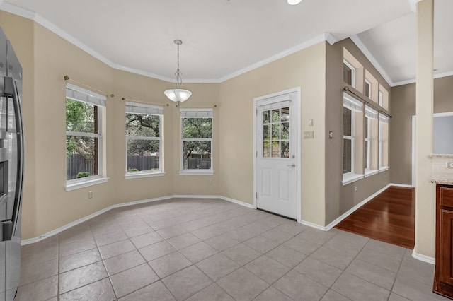 202 Muscovy Ln, Cedar Park, TX 78613 - unfurnished dining area with plenty of natural light, light tile patterned flooring, and crown molding