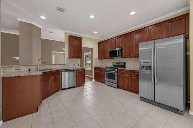 202 Muscovy Ln, Cedar Park, TX 78613 - kitchen with appliances with stainless steel finishes, tasteful backsplash, light stone countertops, crown molding, and light tile patterned floors