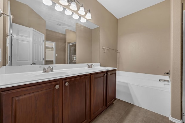 202 Muscovy Ln, Cedar Park, TX 78613 - bathroom with double vanity, a bath, tile patterned flooring, and a stall shower