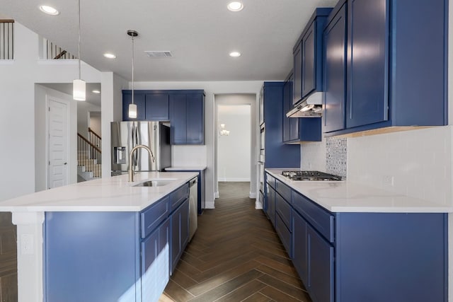 2321 Clear Pond Vw, Leander, TX 78641 - kitchen featuring blue cabinets, stainless steel appliances, tasteful backsplash, and recessed lighting